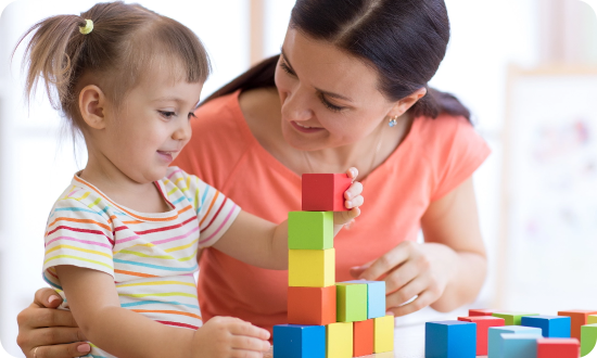 A-staff-is-seen-handling-the-child-Wimbledon-house-nursery.