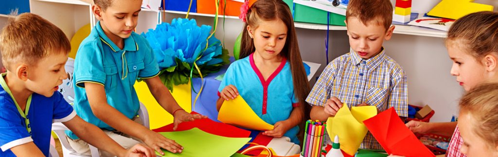 Some children are seen making a project - Wimbledon Day Nursery